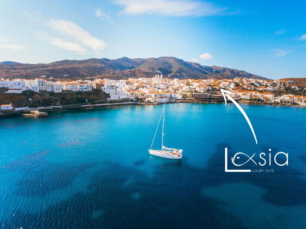 a sail boat in a large body of water at Lasia Luxury Suite in Andros