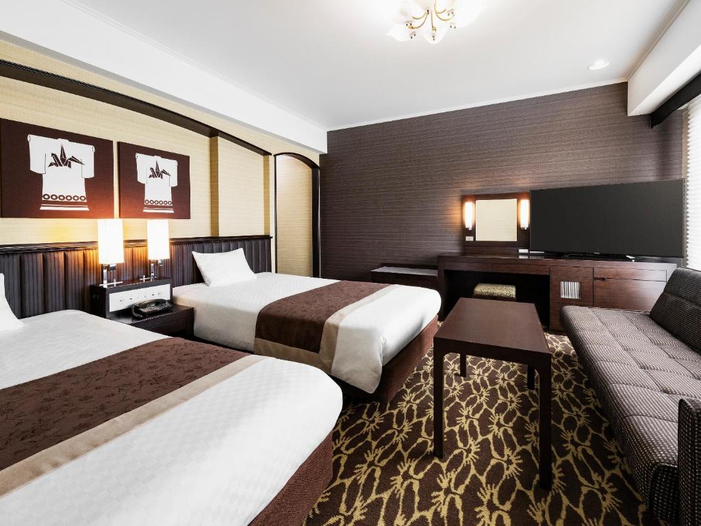 Postel nebo postele na pokoji v ubytování Hotel New Hankyu Kyoto