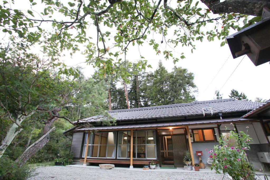 a house in the middle of a forest at あんばええ 