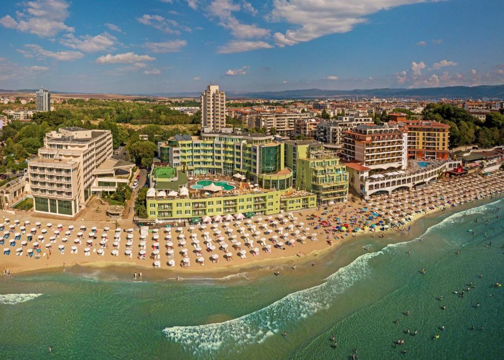 an aerial view of a beach with umbrellas and buildings at MPM Hotel Arsena - Ultra All Inclusive in Nesebar