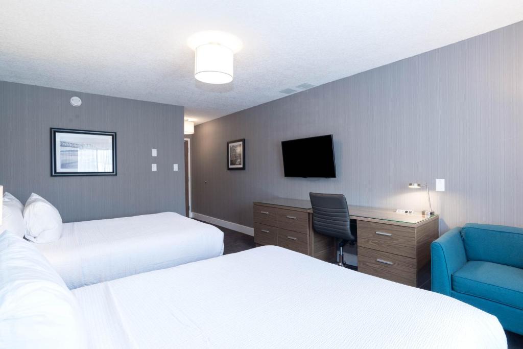 Postel nebo postele na pokoji v ubytování Sandman Hotel Edmonton West