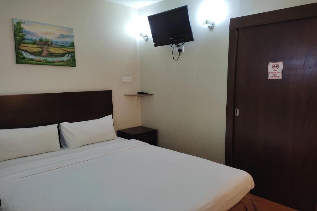 Postel nebo postele na pokoji v ubytování Hotel D'New 1 KK Sabah