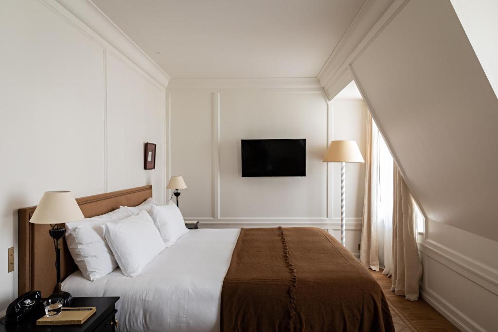 Postel nebo postele na pokoji v ubytování Hôtel Balzac Paris & Spa Ikoï