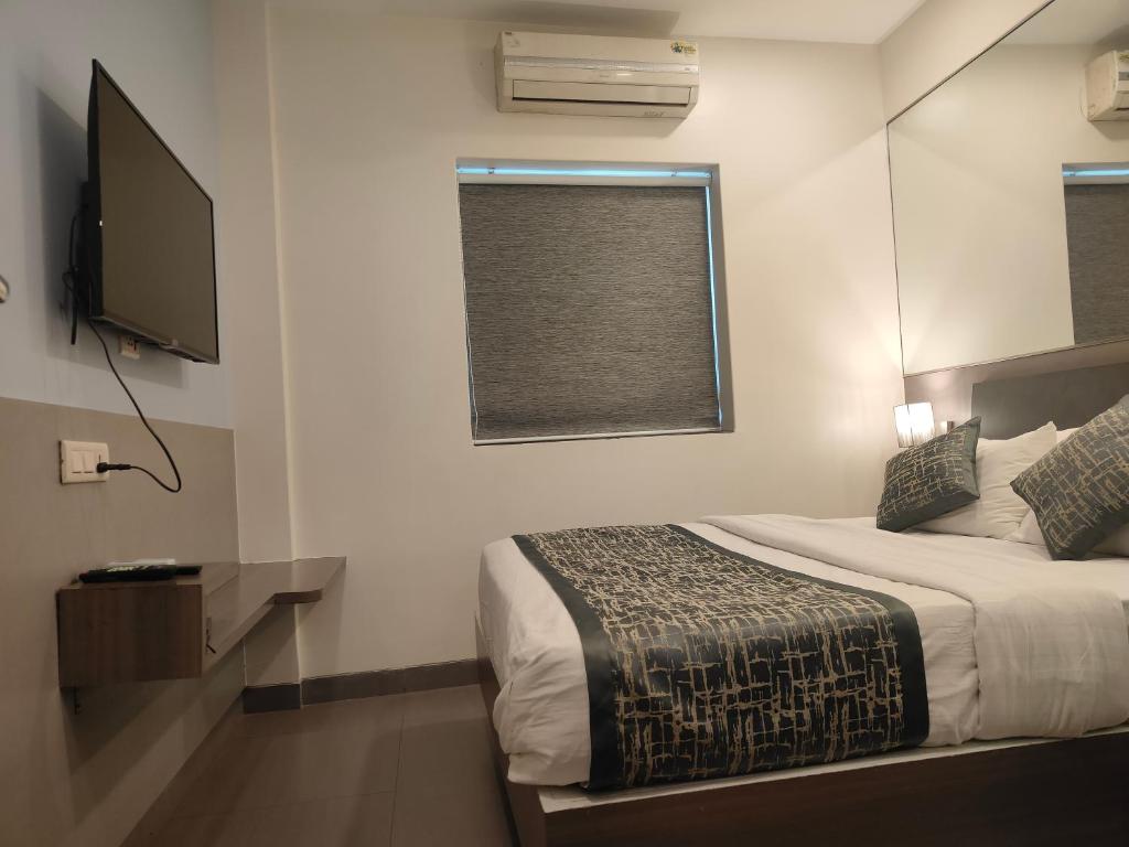 Uma cama ou camas num quarto em Apollo Guest House