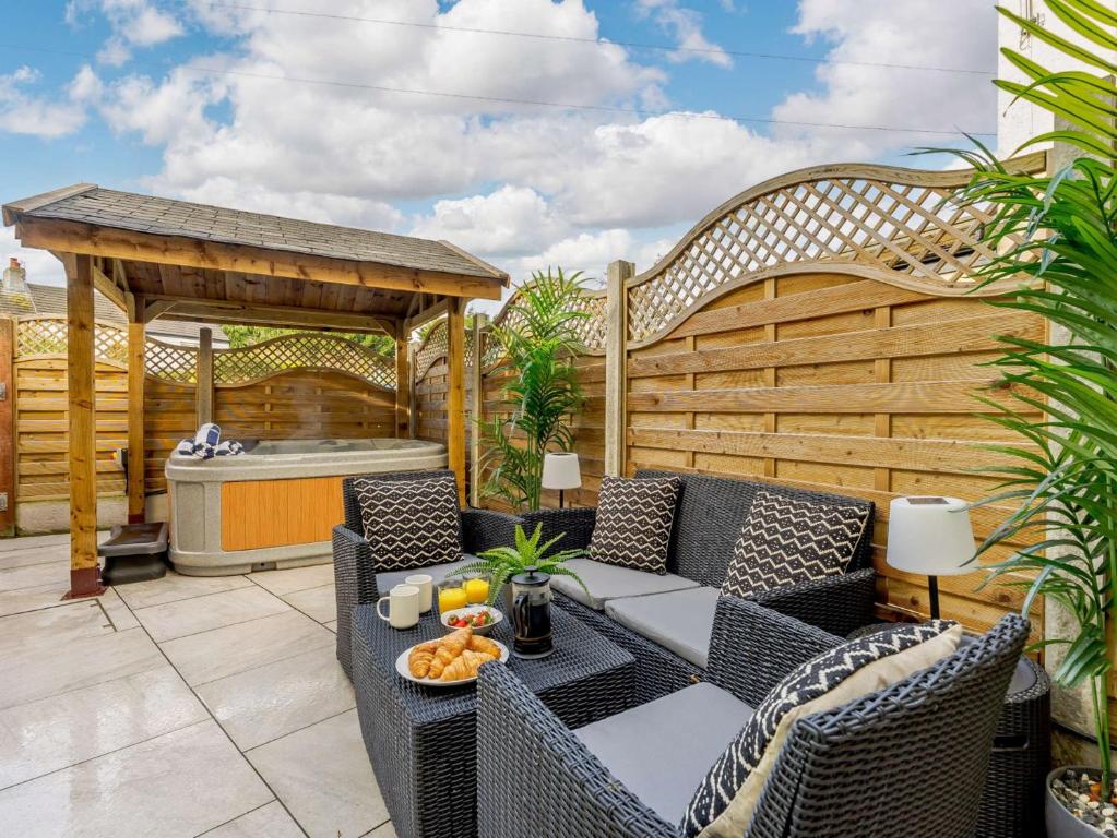 a patio with a table and chairs and a gazebo at 3 Bed in Great Ayton 85937 in Great Ayton