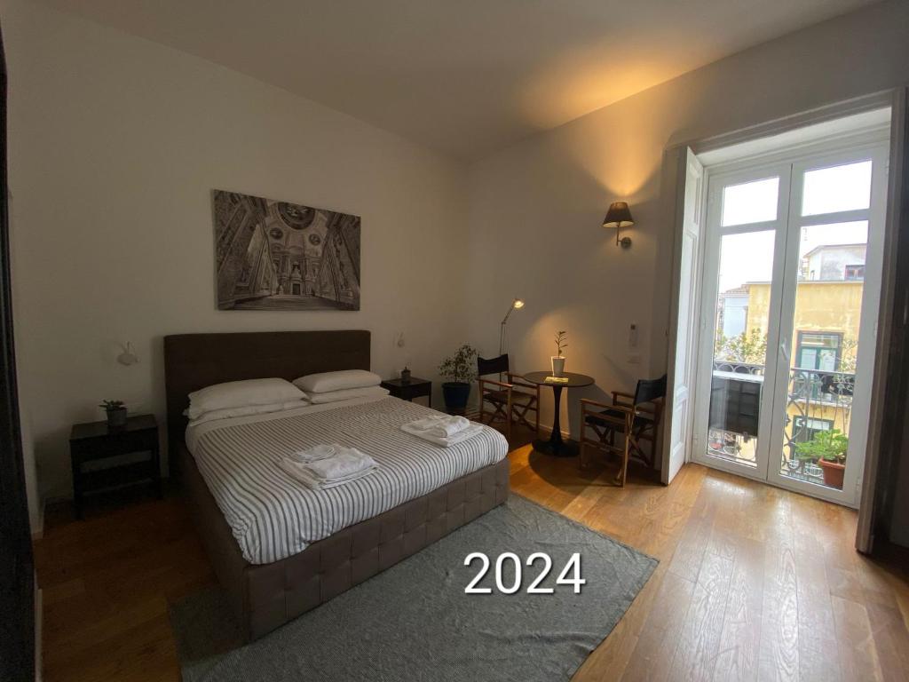 A bed or beds in a room at Vicolo dei Sartori