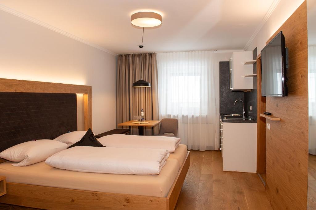 Postel nebo postele na pokoji v ubytování Hotel Bockmaier