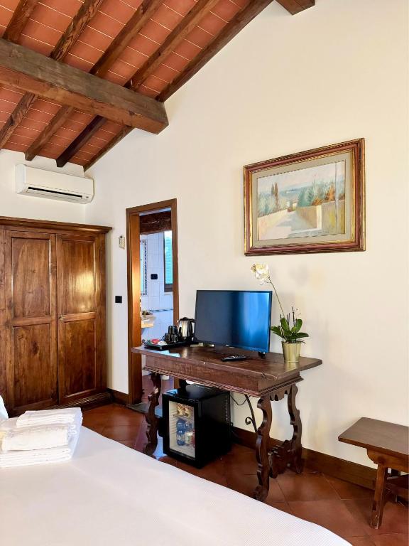 TV a/nebo společenská místnost v ubytování Hotel Relais Il Cestello
