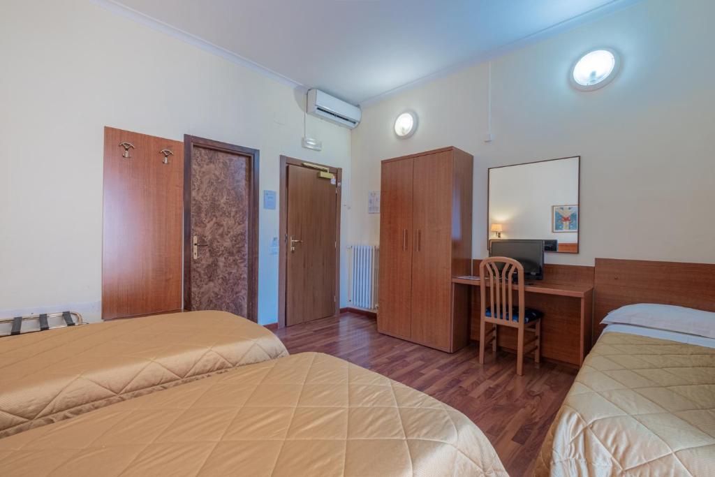 Postel nebo postele na pokoji v ubytování Hotel Monte Verde
