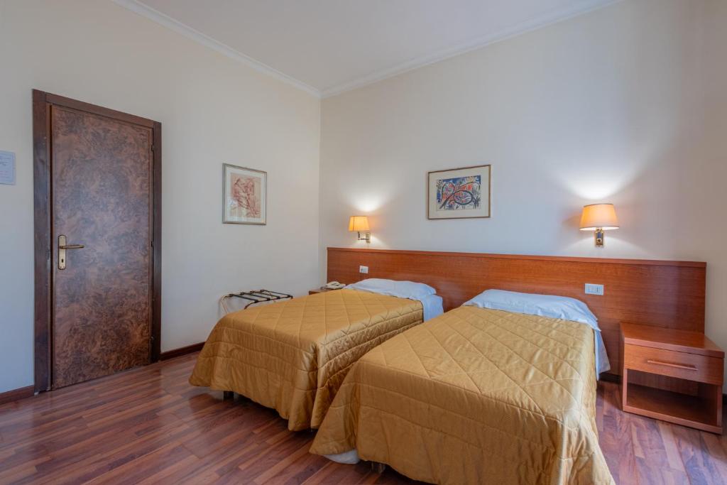 Postel nebo postele na pokoji v ubytování Hotel Monte Verde