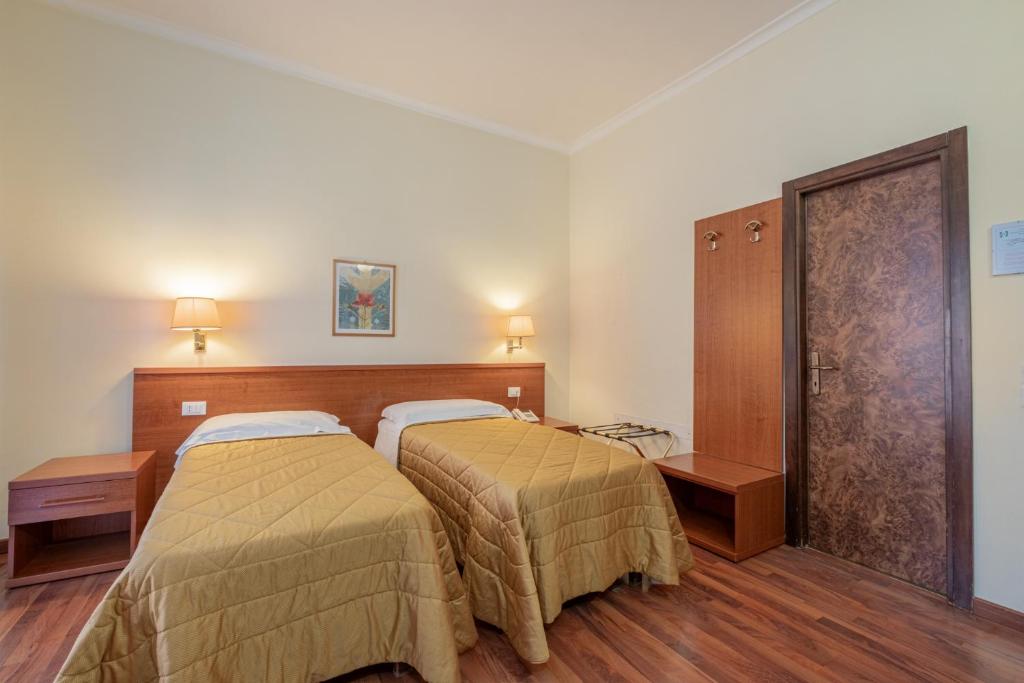 Postel nebo postele na pokoji v ubytování Hotel Monte Verde