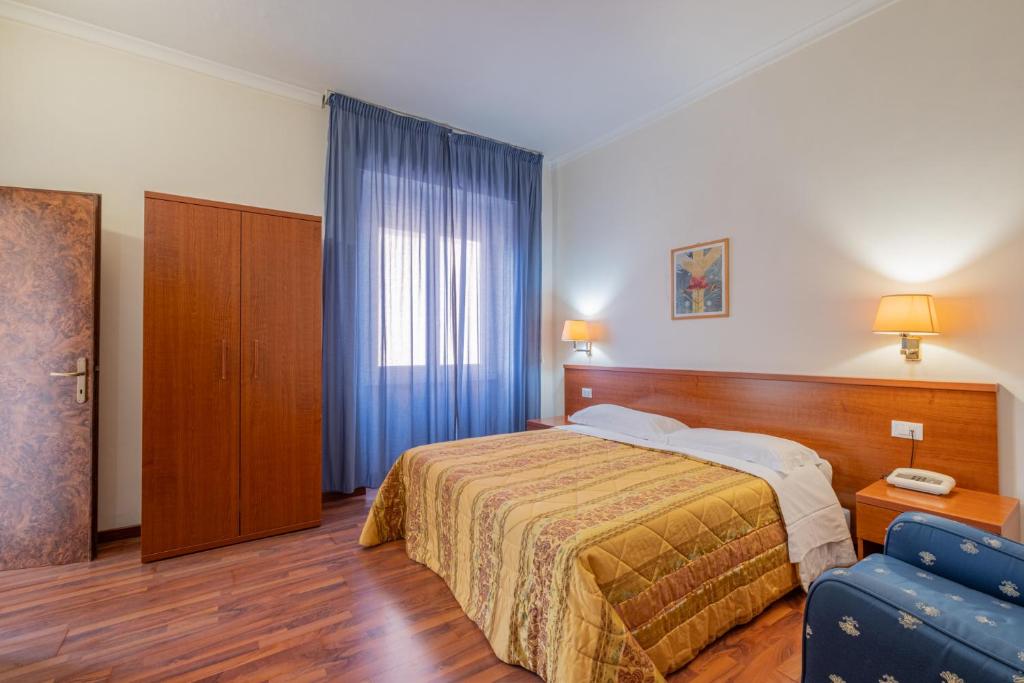 Postel nebo postele na pokoji v ubytování Hotel Monte Verde