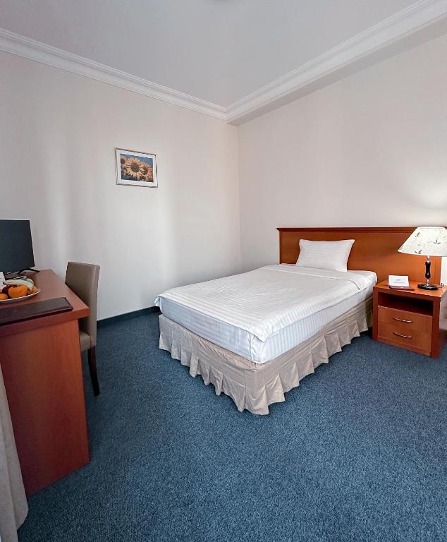 Postel nebo postele na pokoji v ubytování Aviatrans Hotel