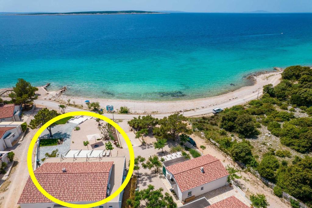 an aerial view of a beach and the ocean at Beachfront Paladina holiday home in Kolan