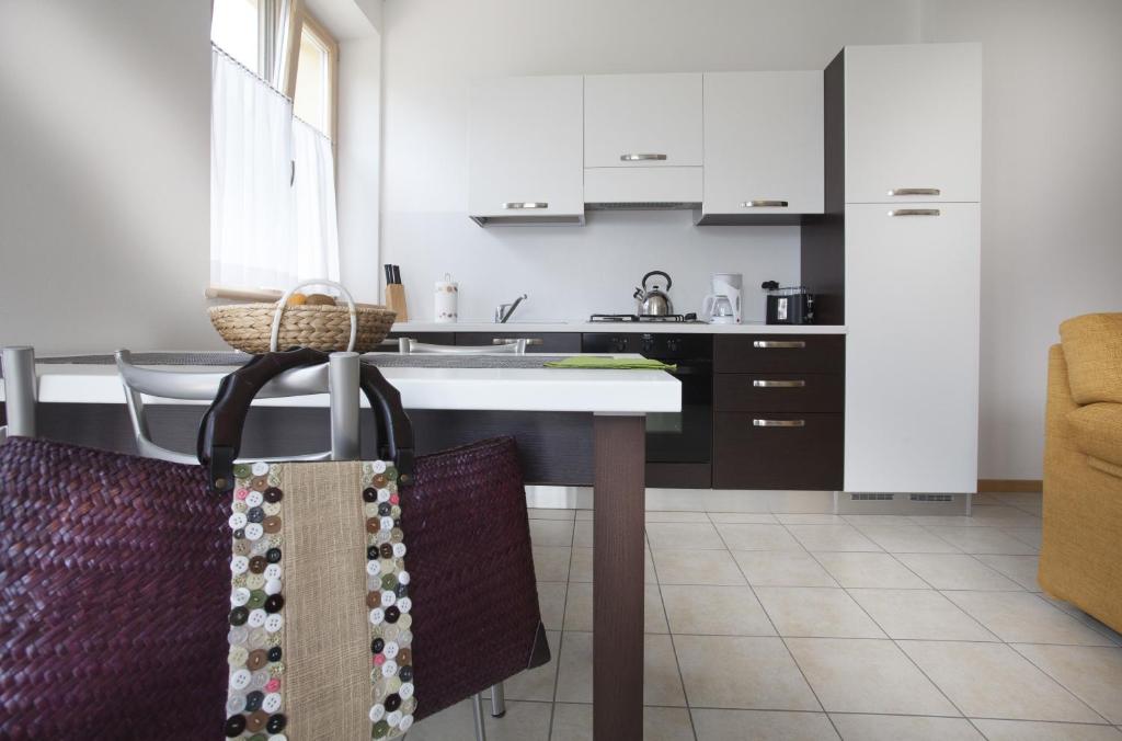 Kuchyň nebo kuchyňský kout v ubytování Appartamenti Al Vigneto