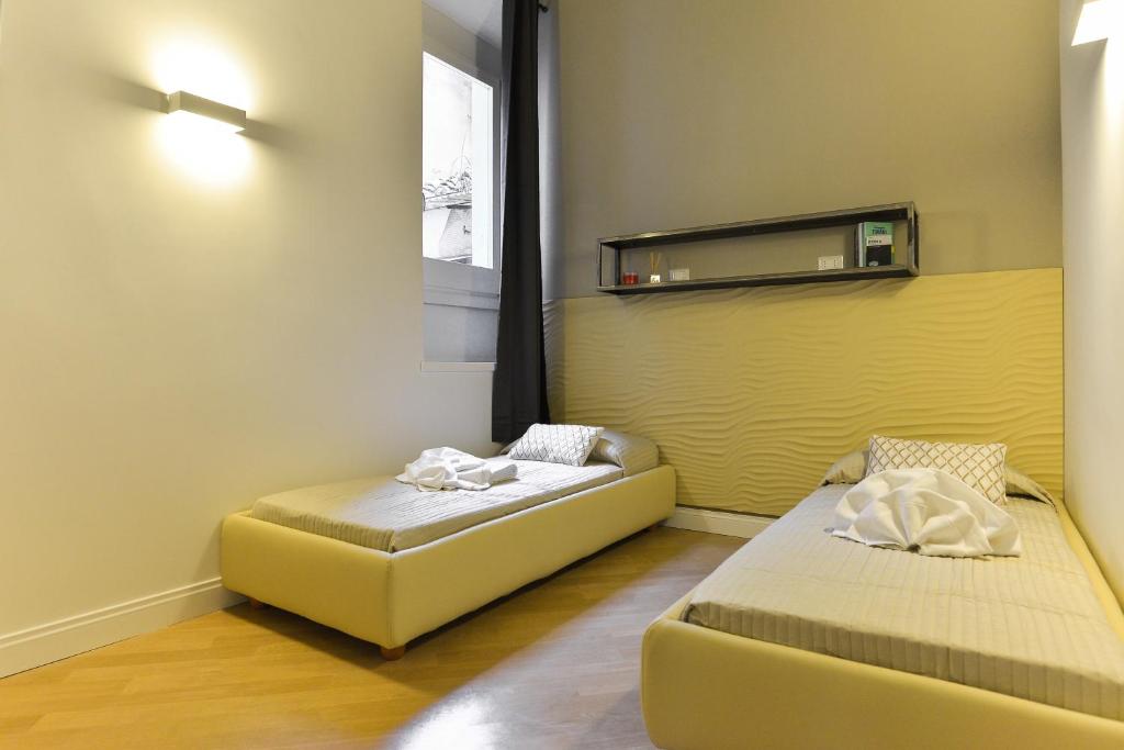 Łóżko lub łóżka w pokoju w obiekcie EVE Luxury Apartments Pantheon