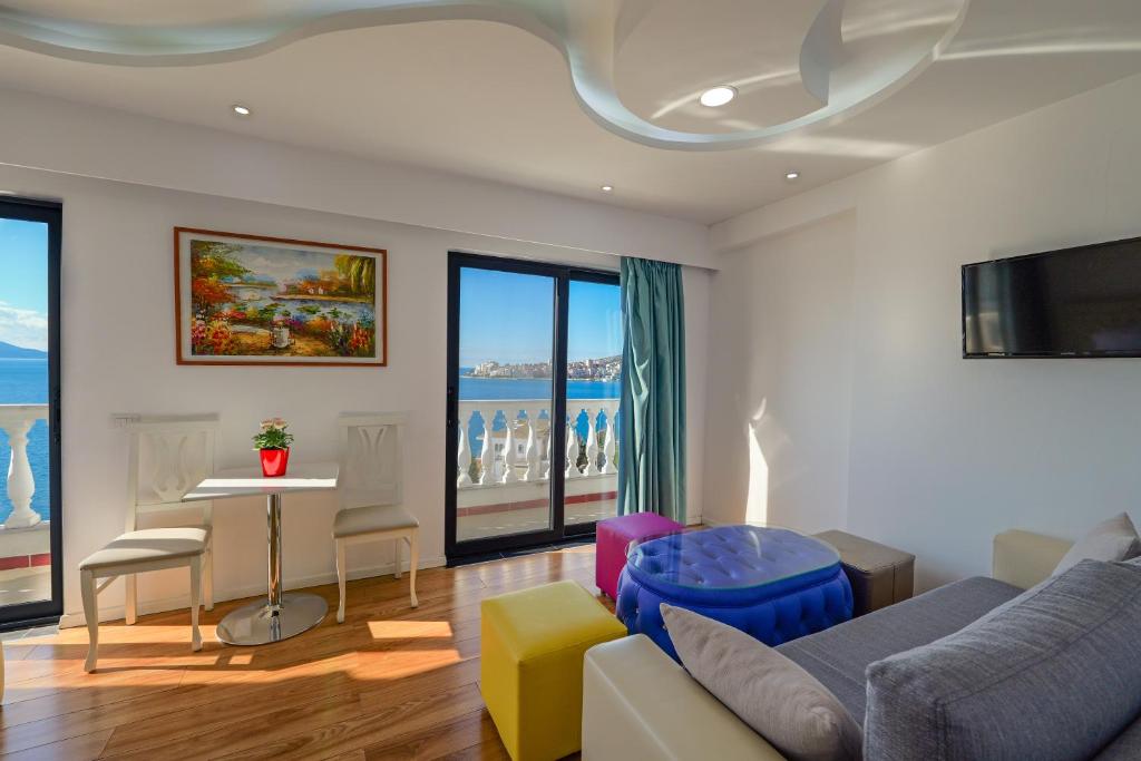 a living room with a couch and a table at Hotel Iliria in Sarandë