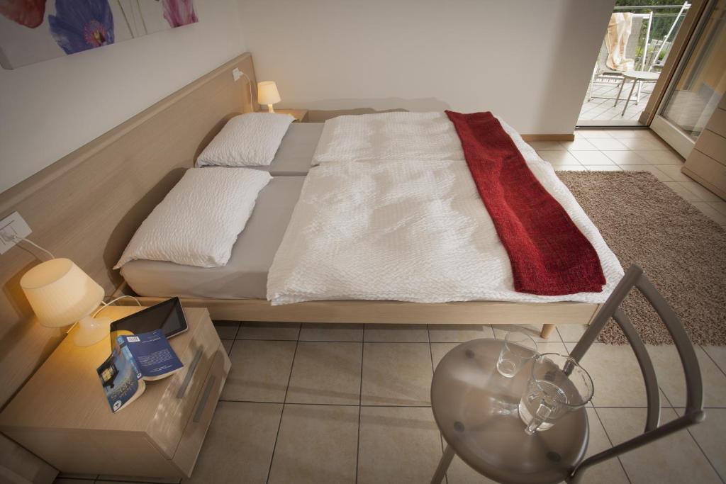 Postel nebo postele na pokoji v ubytování Appartamenti Al Vigneto
