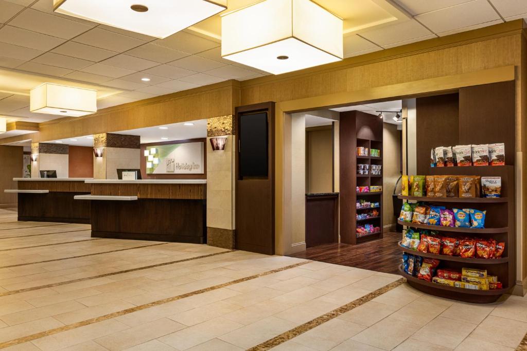 a waiting area of a store with a soda aisle at Holiday Inn Gaithersburg, an IHG Hotel in Gaithersburg
