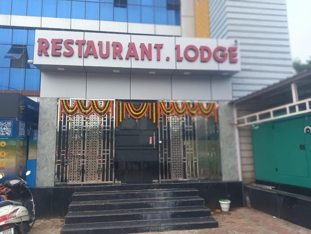 a restaurant with a gate in front of a building at Panda Continental in Bhubaneshwar