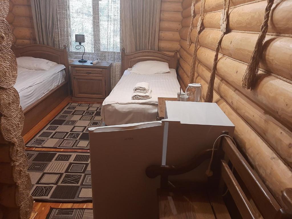Postel nebo postele na pokoji v ubytování Арніка