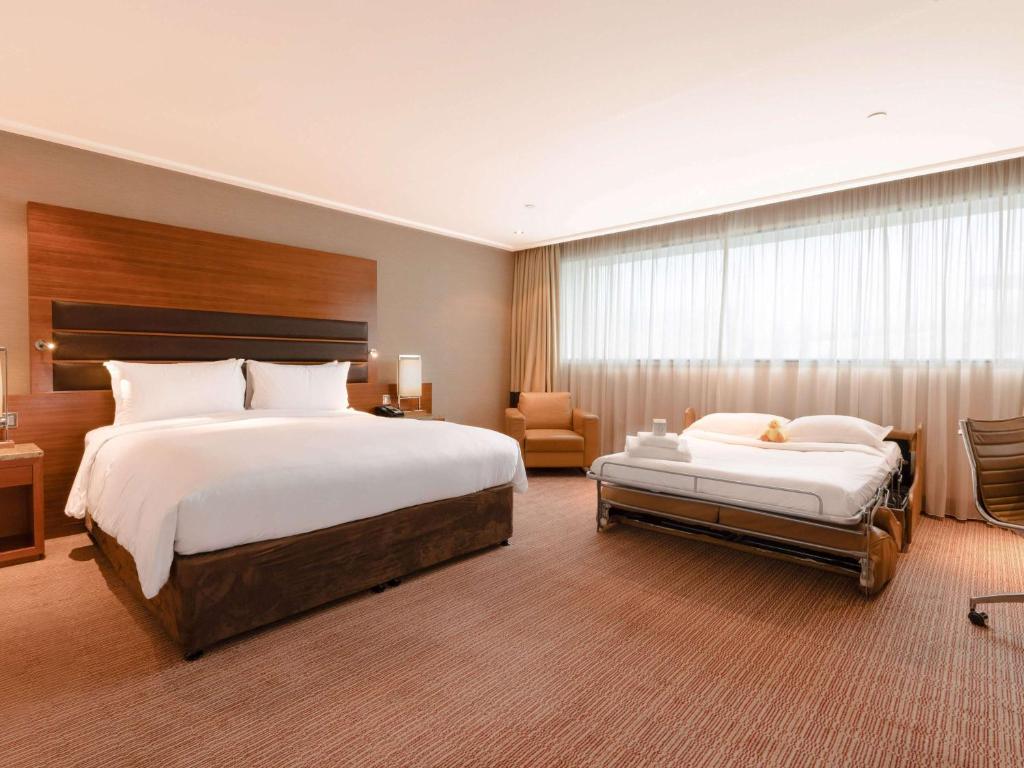 Postel nebo postele na pokoji v ubytování Sofitel London Heathrow