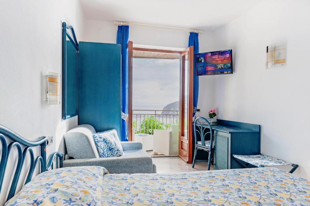 Postel nebo postele na pokoji v ubytování Punta Chiarito Resort