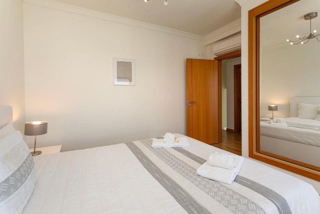 Postel nebo postele na pokoji v ubytování TAC - Pêra Gardens Villa