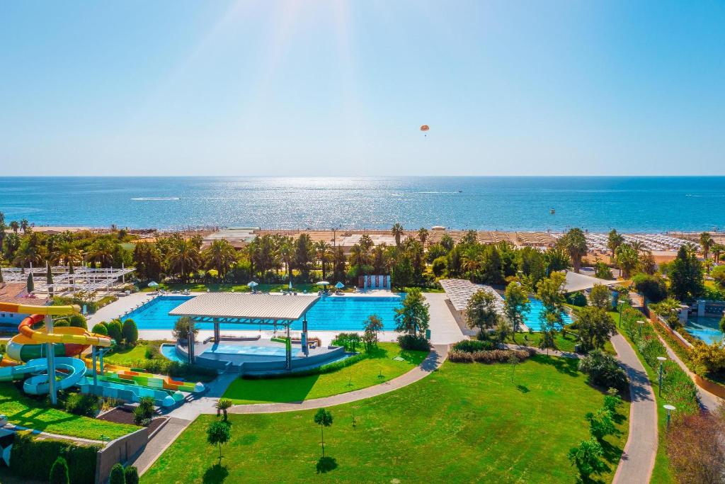 an aerial view of a resort with a pool and the ocean at TUl BLUE Xanthe - Ultra All Inclusive in Side