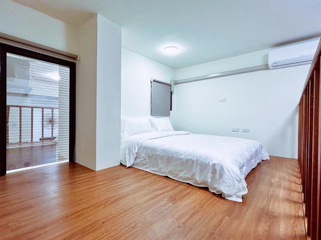 Postel nebo postele na pokoji v ubytování Xianwang Homestay