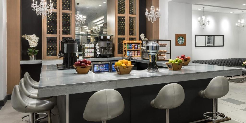a lobby with a counter with fruit on it at The Manhattan at Times Square in New York