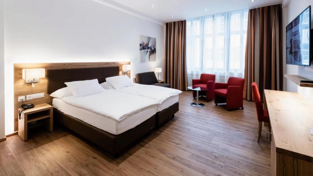 Letto o letti in una camera di Central City Hotel Rochat