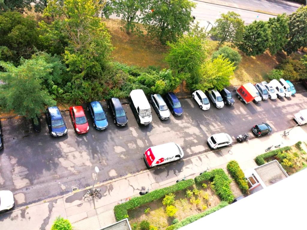 an aerial view of a parking lot with cars at Cozy trendy spacious room in green area 12 min. near to the center Alexanderplatz in Berlin