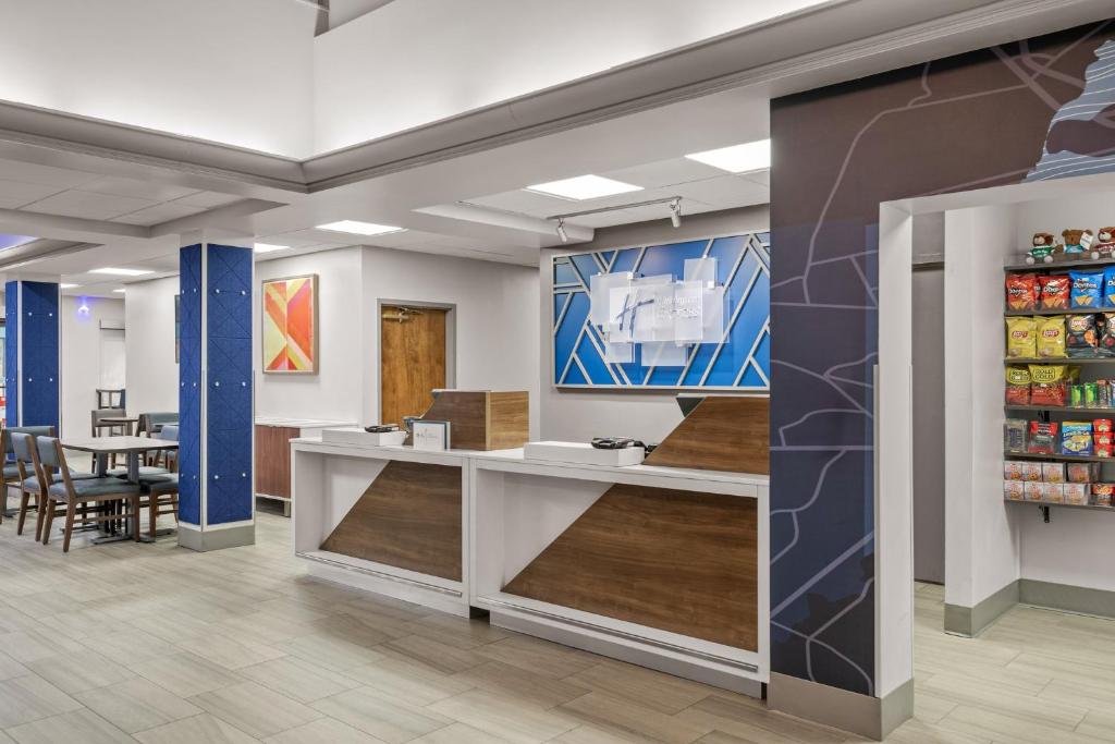 a lobby of a store with a table and chairs at Holiday Inn Express Hershey-Harrisburg Area, an IHG Hotel in Hershey