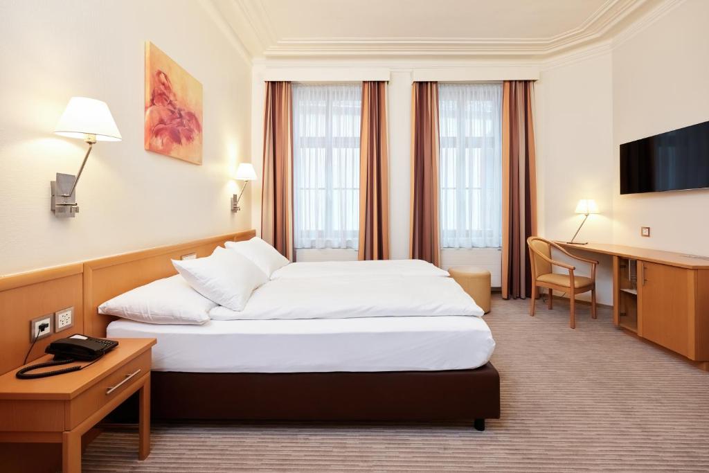 Letto o letti in una camera di Central City Hotel Rochat