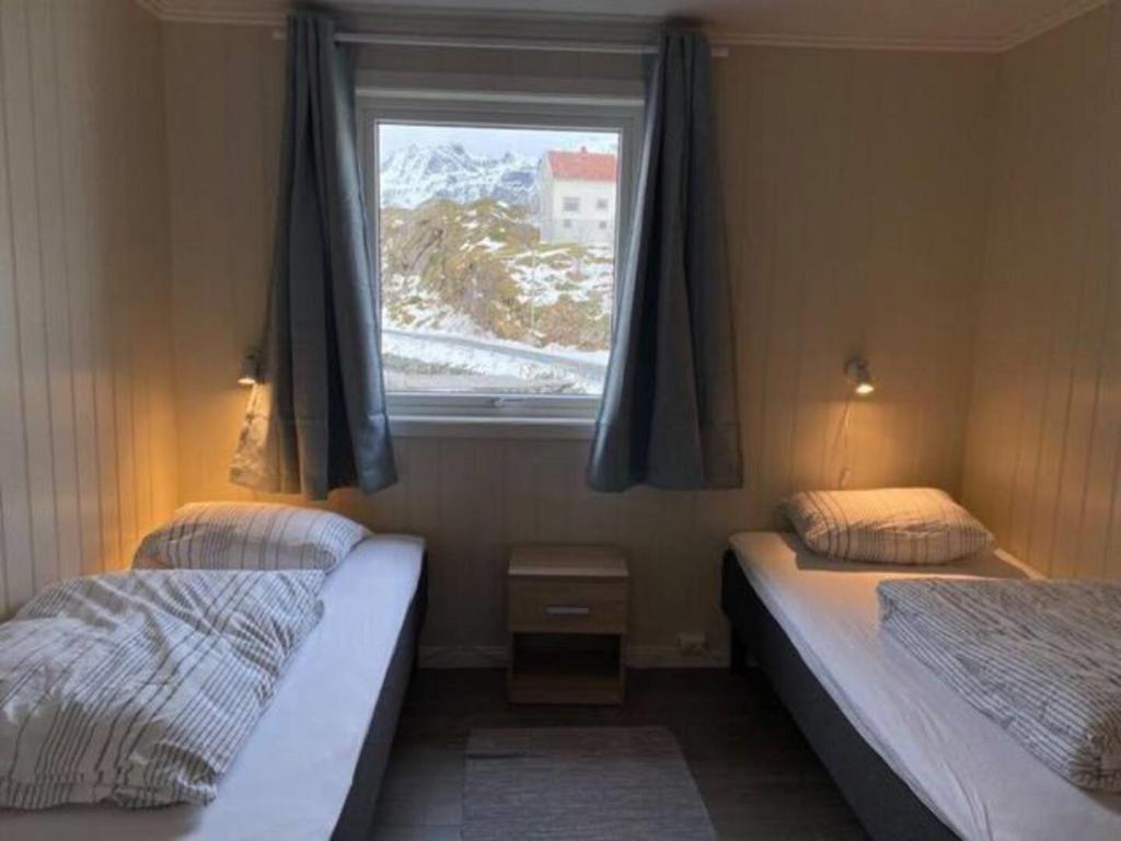 En eller flere senger på et rom på Damperiholmen cabin