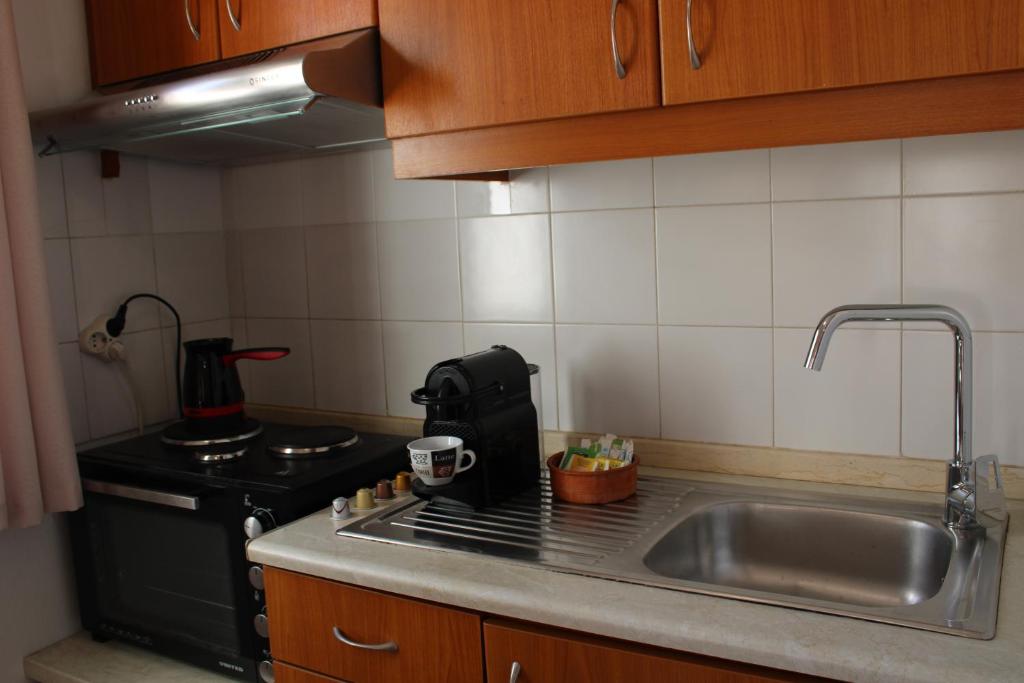 Kuchyň nebo kuchyňský kout v ubytování Elounda Square Home