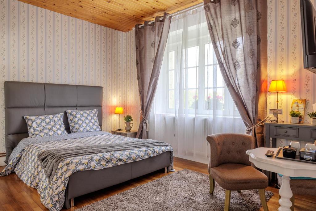 Postel nebo postele na pokoji v ubytování ARVEIL