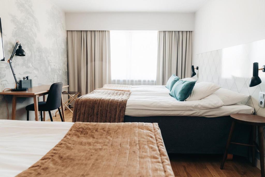 Postel nebo postele na pokoji v ubytování Quality Hotel Ekoxen