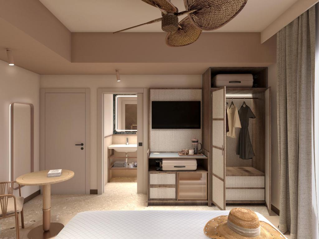 リド・ディ・イエゾロにあるHotel Dianaのベッドルーム1室(ベッド1台付)、ドレッシングル ームが備わります。