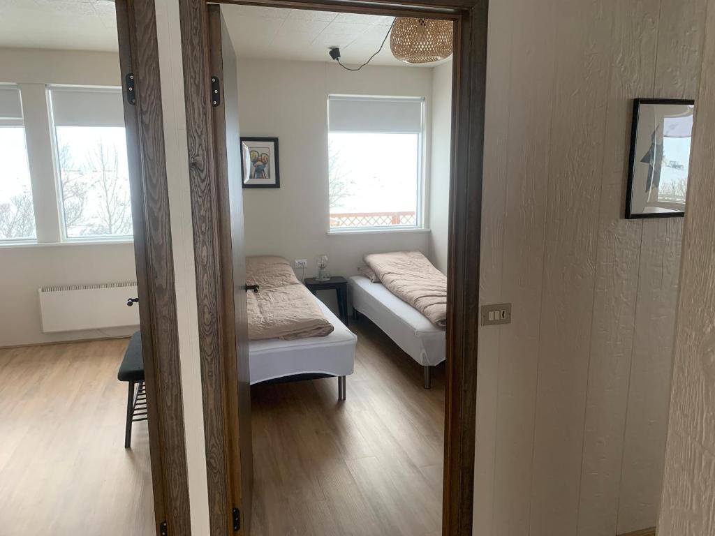 Postel nebo postele na pokoji v ubytování Fossar Villa