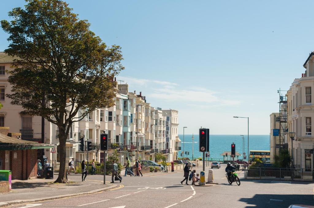 a busy city street with people crossing the street at INNit Bliss in Brighton & Hove