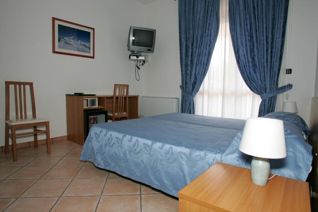 Postel nebo postele na pokoji v ubytování Hotel la Colletta