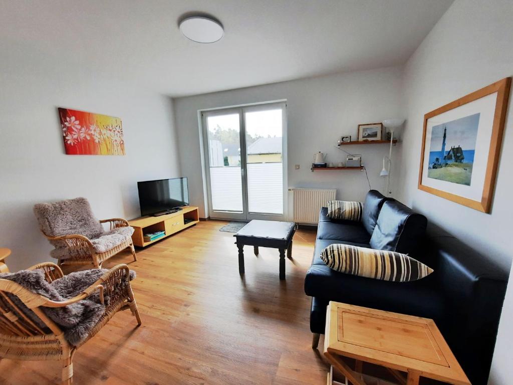 TV a/nebo společenská místnost v ubytování Ferienwohnung 9 in der Strandstraße