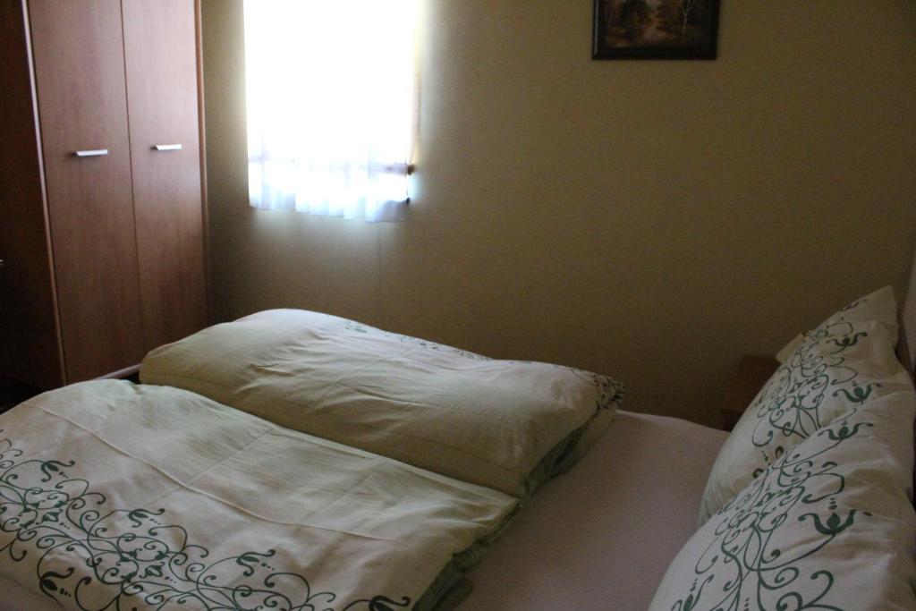 Postel nebo postele na pokoji v ubytování Privat pri Hradbach