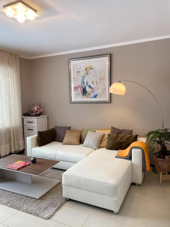 a living room with a couch and a table at Wohnung mitten in der Altstadt in Koblenz