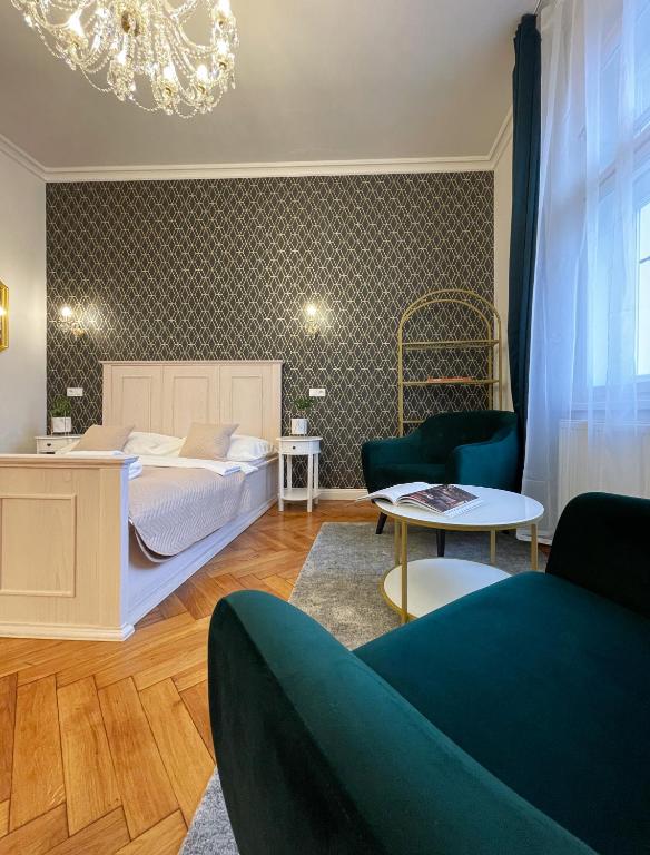 a bedroom with a bed and a living room at Stupartska 9 - Premium Old Town Residence in Prague