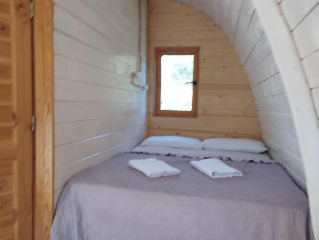 Postel nebo postele na pokoji v ubytování holiday home su Niberalzu