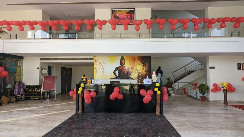 a room with red balloons and a table in a building at HOTEL METTEYYE RESIDENCY in Padrauna