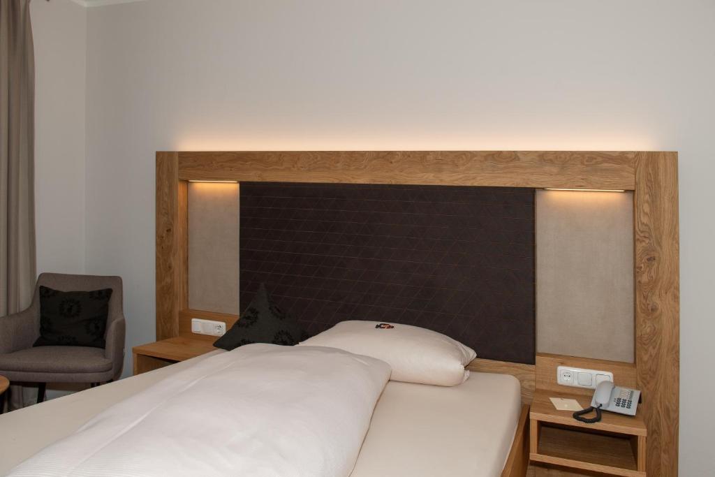 Postel nebo postele na pokoji v ubytování Hotel Bockmaier